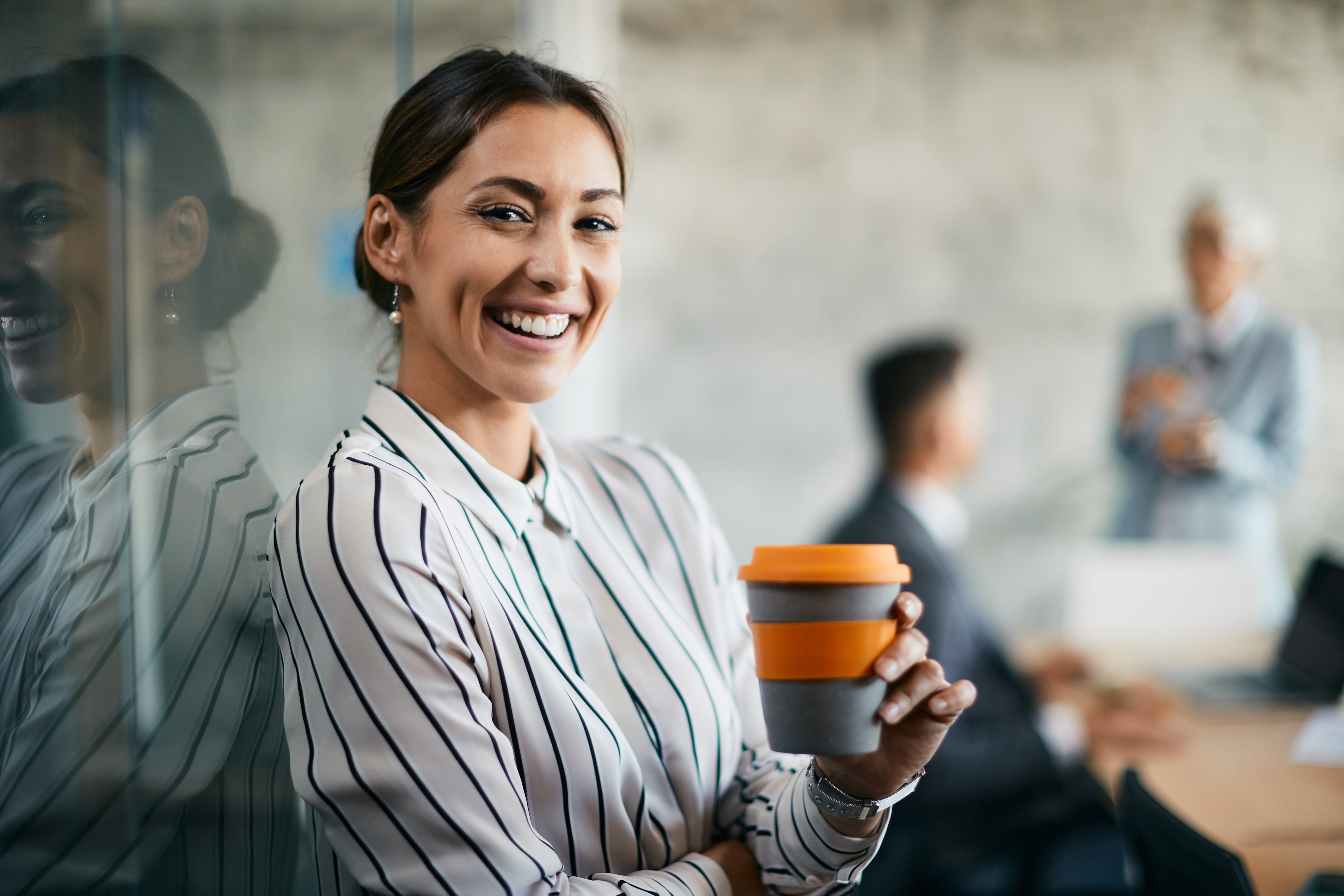 young-happy-businesswoman-enjoying-in-coffee-break